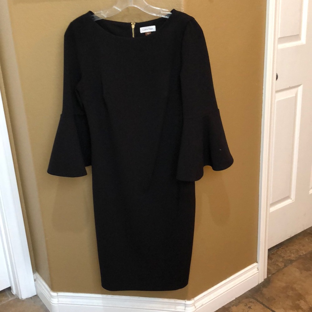 Dress with 3/4” length sleeves
